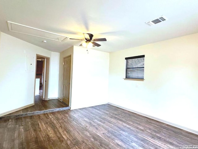 unfurnished room with dark hardwood / wood-style floors and ceiling fan