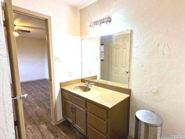 bathroom featuring ceiling fan, vanity, and hardwood / wood-style flooring