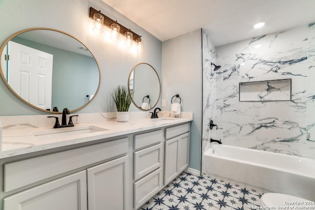 bathroom featuring vanity and tiled shower / bath