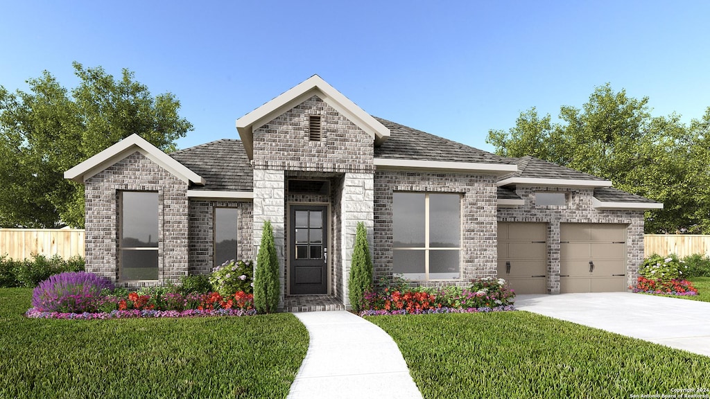 view of front of house with a garage and a front yard