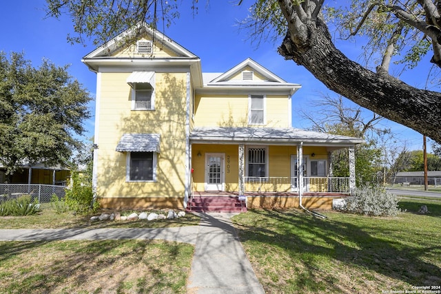 view of front of house featuring a porch and a front yard