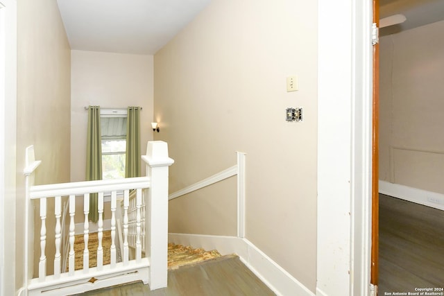 stairway with wood-type flooring