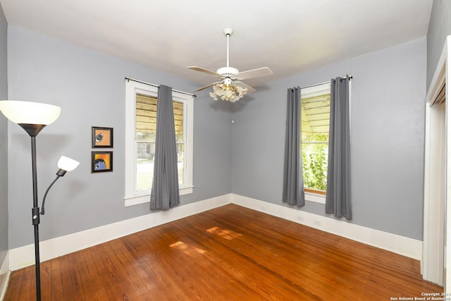 unfurnished room featuring hardwood / wood-style flooring and ceiling fan