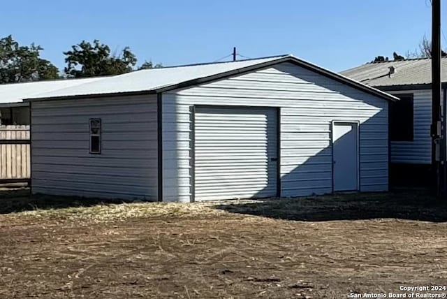 view of outbuilding with a garage