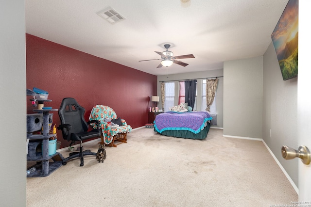 bedroom with ceiling fan and carpet