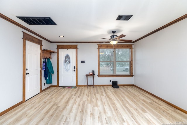 entrance foyer featuring ceiling fan, light hardwood / wood-style floors, and ornamental molding