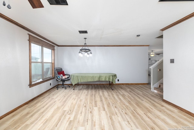 interior space with ceiling fan with notable chandelier, light wood-type flooring, and ornamental molding