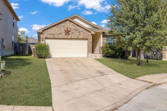 view of front of property with a garage and a front lawn