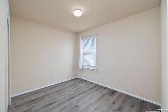 spare room with light hardwood / wood-style floors