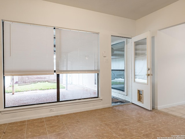 interior space featuring light tile patterned floors and a wealth of natural light