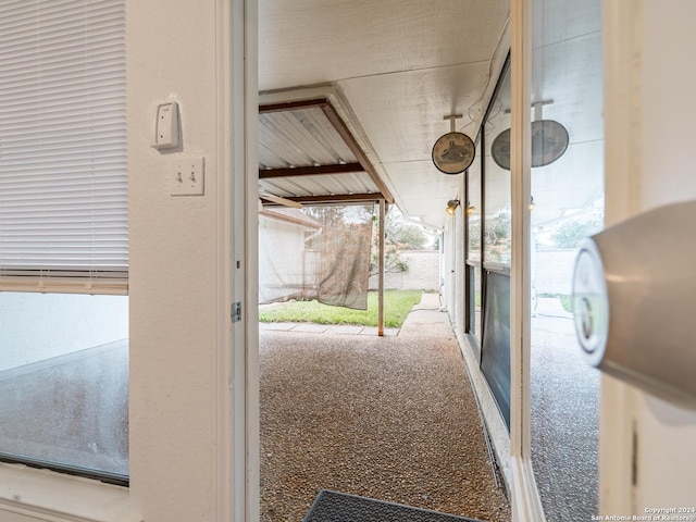 doorway with carpet flooring