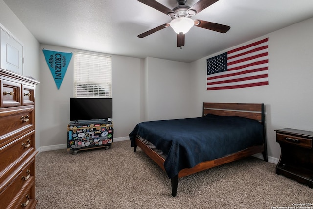 bedroom featuring ceiling fan and light carpet