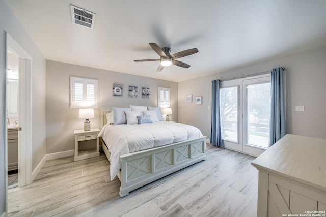 bedroom featuring ceiling fan, light hardwood / wood-style floors, access to exterior, and connected bathroom