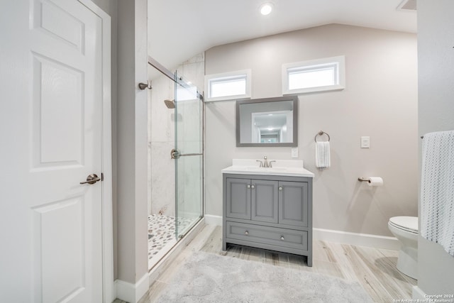 bathroom featuring vanity, a shower with door, hardwood / wood-style flooring, toilet, and lofted ceiling