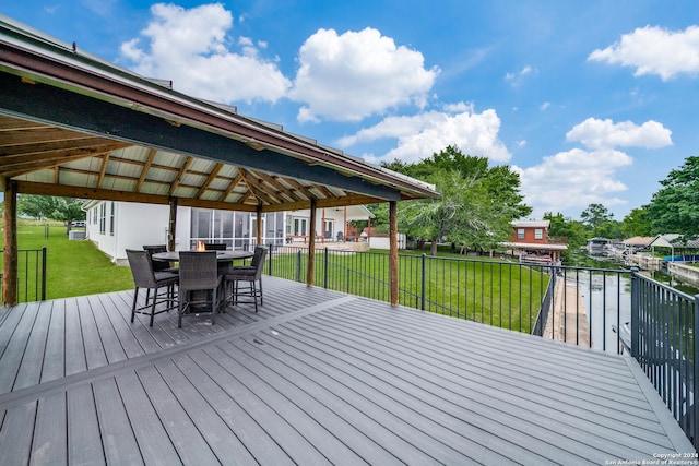 wooden deck with a yard