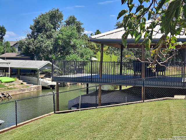 exterior space featuring a yard and a water view