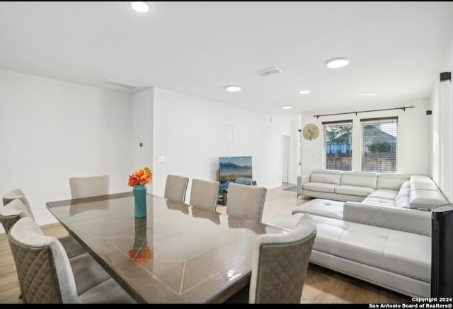 dining area with hardwood / wood-style flooring