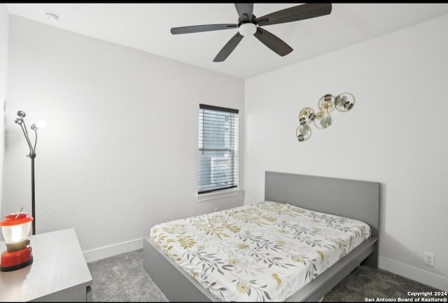 bedroom with dark carpet and ceiling fan