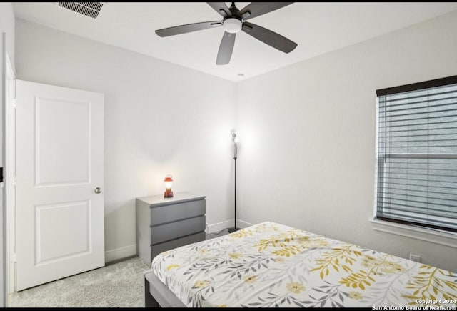 carpeted bedroom with ceiling fan