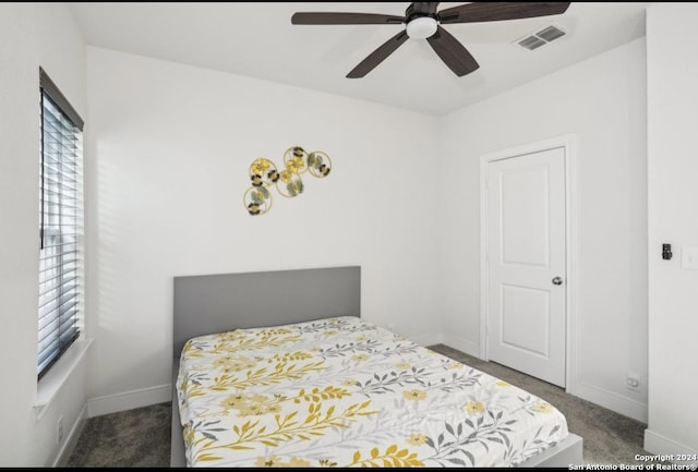 carpeted bedroom featuring ceiling fan