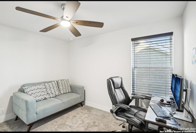 carpeted home office with ceiling fan