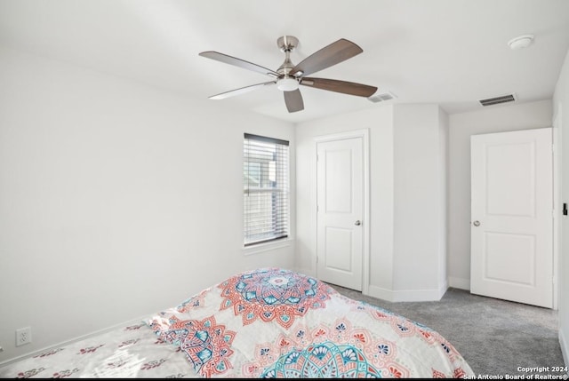 unfurnished bedroom featuring carpet floors and ceiling fan