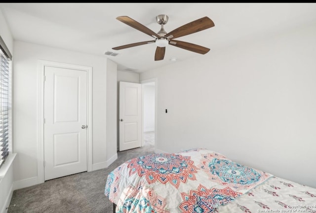 bedroom featuring light carpet and ceiling fan