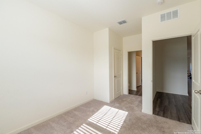 unfurnished bedroom with light carpet