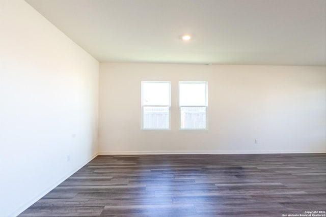 spare room featuring dark hardwood / wood-style floors