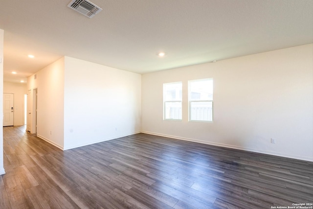 empty room with dark hardwood / wood-style floors