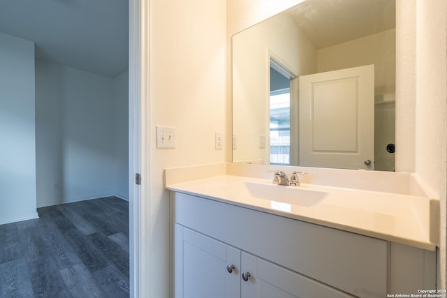 bathroom featuring hardwood / wood-style floors and vanity