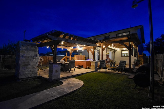 exterior space with a bar, a pergola, a yard, and a hot tub