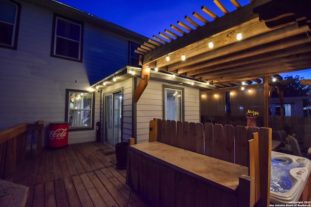 wooden terrace featuring a pergola and a hot tub