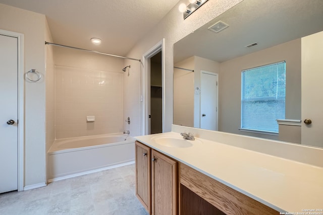 4735 Brook N, San Antonio, TX 78238 - bathroom featuring shower / bath combination, vanity, and a textured ceiling