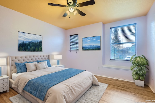 bedroom featuring ceiling fan and light hardwood / wood-style floors