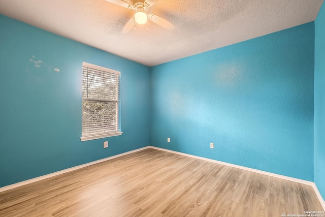 4735 Brook N, San Antonio, TX 78238 - spare room with wood finished floors, ceiling fan, a textured ceiling, and baseboards