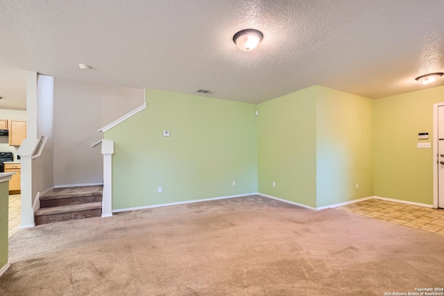 4735 Brook N, San Antonio, TX 78238 - unfurnished living room with a textured ceiling, light carpet, stairway, and baseboards