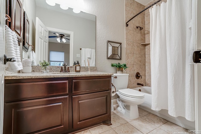 full bathroom featuring ceiling fan, tile patterned flooring, shower / bath combination with curtain, toilet, and vanity