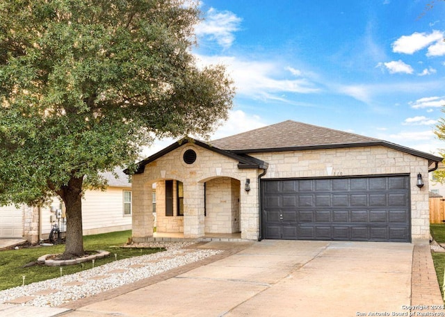 single story home featuring a garage