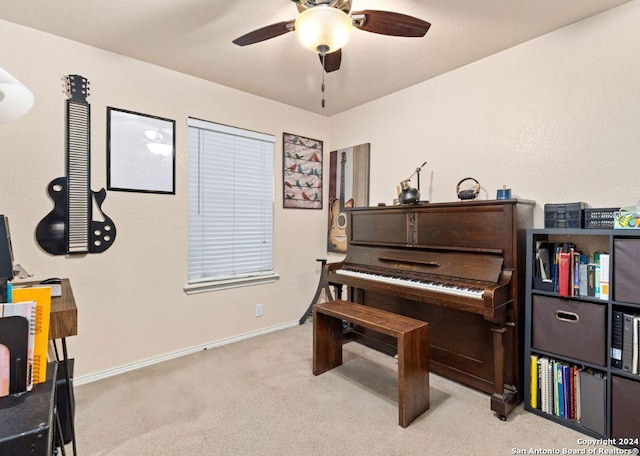 miscellaneous room featuring light colored carpet and ceiling fan