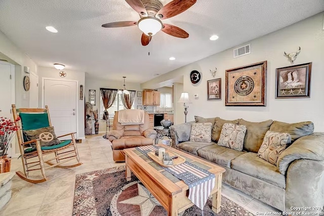 living room featuring a textured ceiling, ceiling fan, and beverage cooler