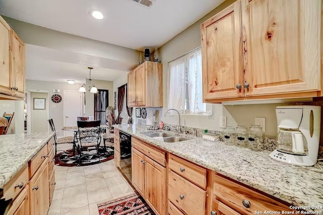 kitchen with light brown cabinetry, sink, pendant lighting, dishwasher, and a chandelier