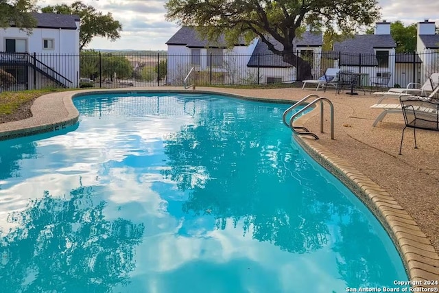 view of swimming pool with a patio area