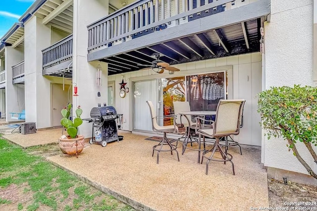 view of patio / terrace featuring ceiling fan and a grill