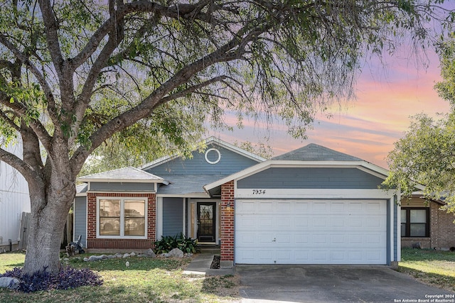 ranch-style house featuring a garage