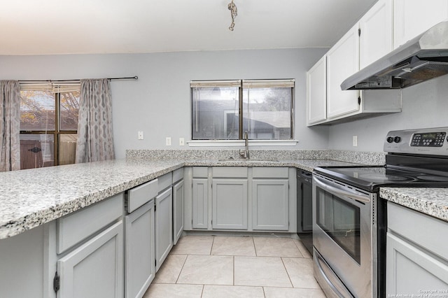 kitchen featuring appliances with stainless steel finishes, sink, exhaust hood, light tile patterned floors, and gray cabinets