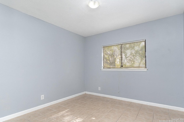 view of tiled spare room