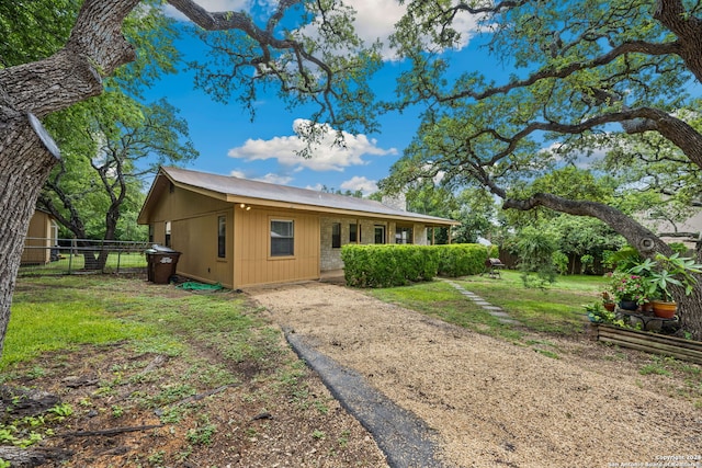 view of front of home featuring covered porch and a front yard