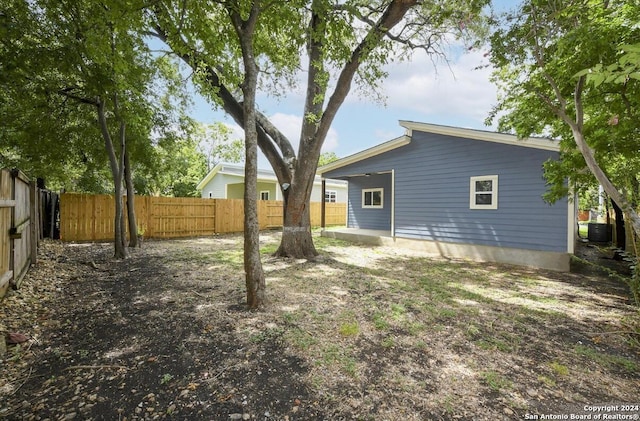 view of yard with central AC