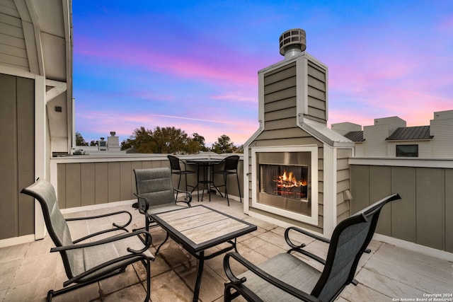 exterior space featuring a patio and exterior fireplace